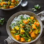 Vegetarisches Kürbis-Curry mit Erbsen (mild scharf)